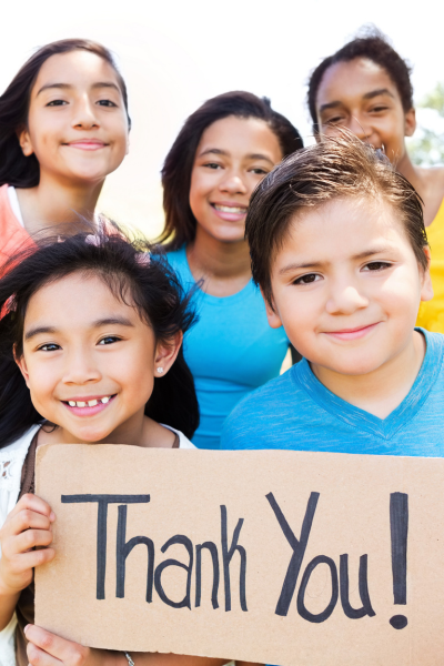 Kids holding thank you sign